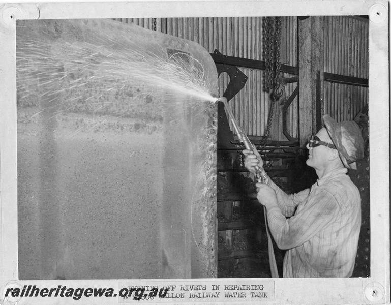 P00141
Workman burning of rivets in repairing a tender, MRWA Workshops, Midland.
