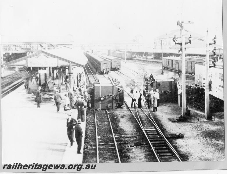 P00389
N class 85,  N class 203  laying on their sides after collision, Perth Station, elevated view of the site looking west from the Barrack Street Bridge
