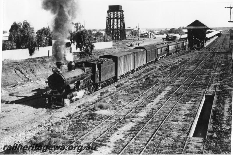 P00456
Commonwealth Railways (CR) G class, signal box, water tower, loco ash pit, Kalgoorlie, departing with the 