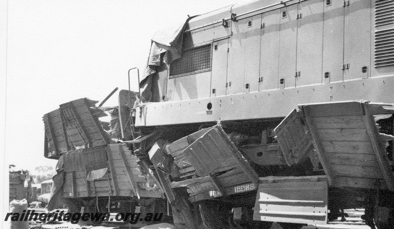 P01030
8 of 10 views of the derailment of A class 1501 at Northam Station, ER line. Loco on top of other wagons, date of derailment 2/11/1961
