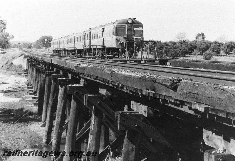 P01418
13 of 16 images of the pair of trestle bridges over the Canning River at Gosnells, SWR line, ADX class railcar set on the bridge, view taken from the north. 
