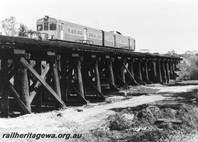 P01419
14 of 16 images of the pair of trestle bridges over the Canning River at Gosnells, SWR line, ADB class, ADK class railcar set on the bridge, view taken from the south east.
