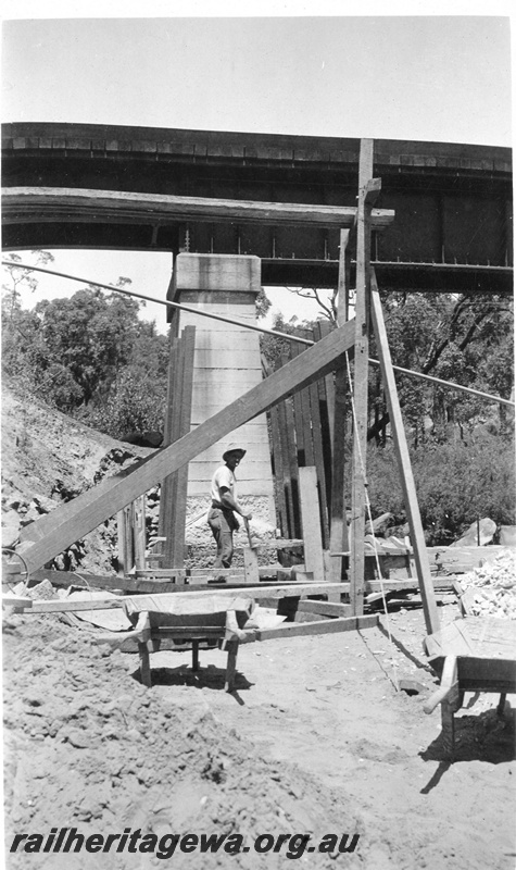 P01426
1 of 13 images of the construction of the duplicate steel girder bridge No.1 at 16 miles 25 chains on the ER through the John Forrest National Park, starting construction on the east pier.
