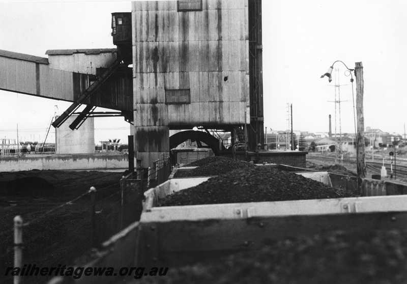 P01620
Rotary coal unloader, South Fremantle Power House, view along the top of the wagons into the unloader
