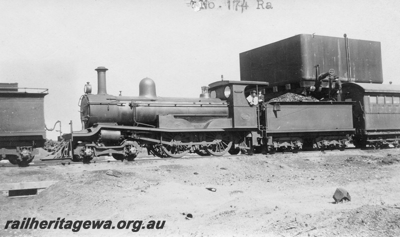 P01655
RA class 174, 4-4-2, taking water at Boondi, EGR line, water tower with 25,000 gallon cast iron water tank, c1926.
