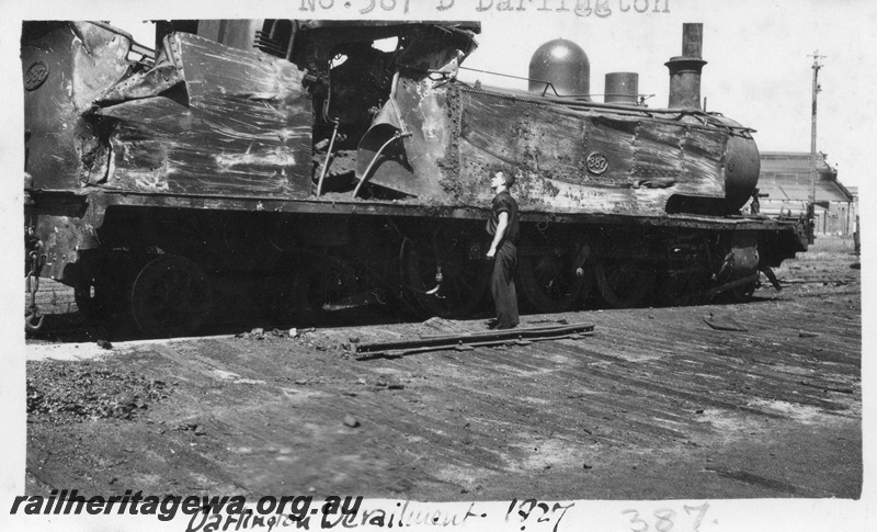 P01669
D class 387 on No. 42 Mixed, damaged in Cape Horn derailment , near Boya, M line. Date of derailment 25/10/1927, Right hand side view  of the damaged loco at Midland Junction.
