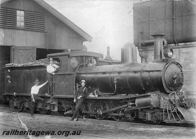 P01745
G class 110, Cue  loco shed, side and front view, James Murrie standing near the tender, Wally King standing on the footplate was killed in WWI and Alick Hill standing next to the loco, 25,000 gallon cast iron  tank on masonry water tower, NR line.
