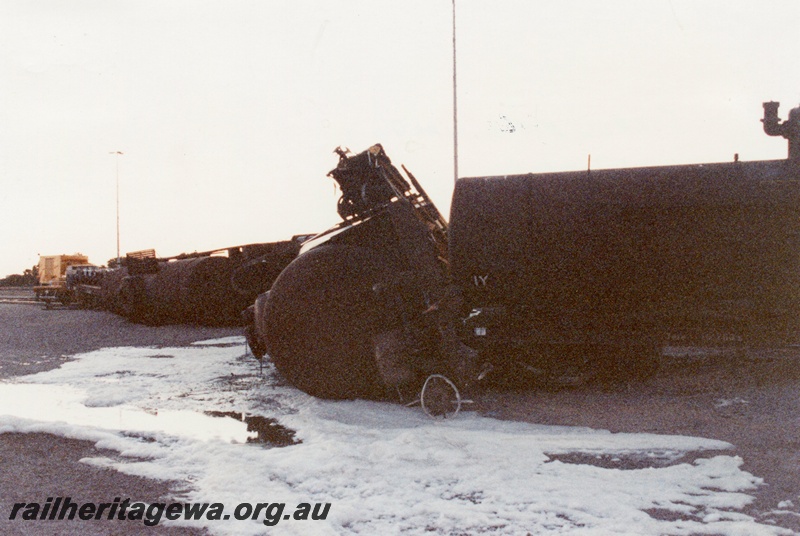 P02546
Derailment, tankers on their side, spillage sprayed with foam, Forrestfield marshalling yard.
