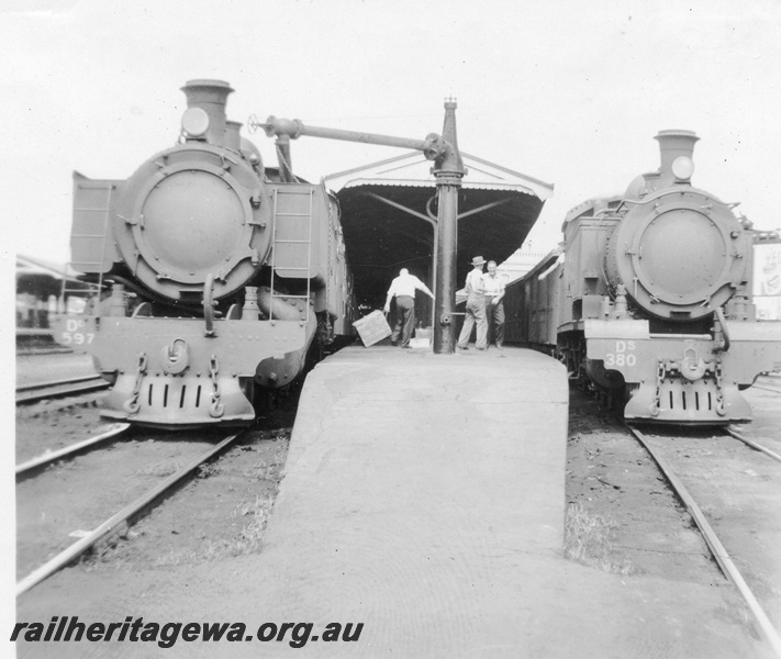 P02667
DD class 597 and DS class 380 steam locomotives taking water at the water column at Perth station platform, front view, ER line.
