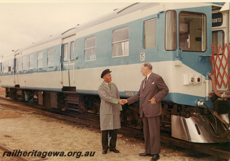 P03801
ADX class 670, Nanking blue and light grey livery, stainless steel cowcatcher, coupled to another railcar, side and end view, Commissioner of Railways, C. G. C. Wayne shaking hands with driver at track side, ER line
