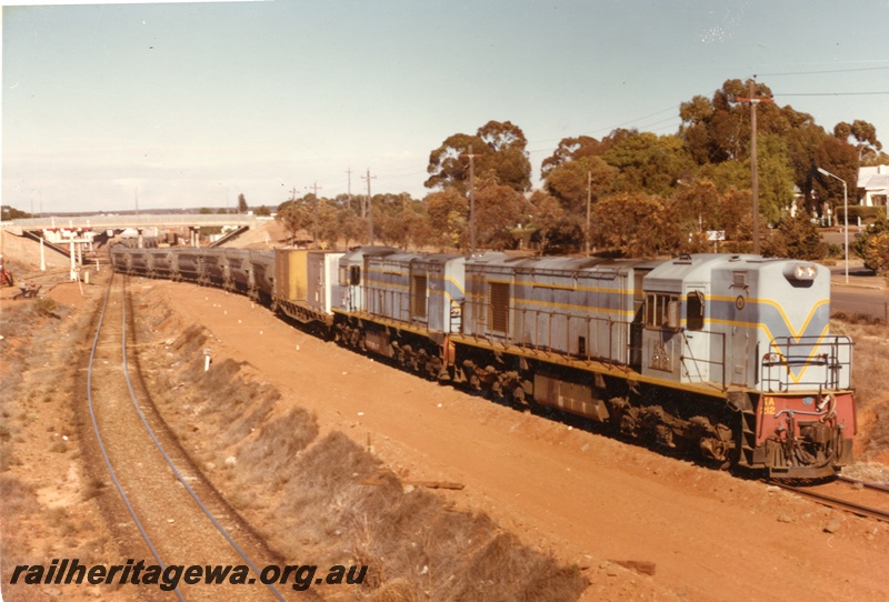 P03911
KA class 212 double heading with another KA class, in the later Westrail blue livery, nickel train, just having passed under the Maritana Street Bridge, Kalgoorlie. View along the train.
