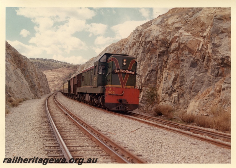 P03962
A Class 1503 diesel locomotive in green with red and yellow stripe livery hauling Up 