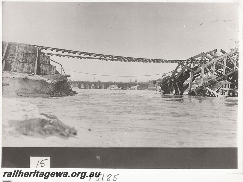P05185
Fremantle Railway Bridge collapse which occurred on the afternoon of the 22nd of July, 1926, side view of the  bridge with the rails suspended over the gap due to the washaway, ER line, See also P02995, P05185, P07085, P07086
