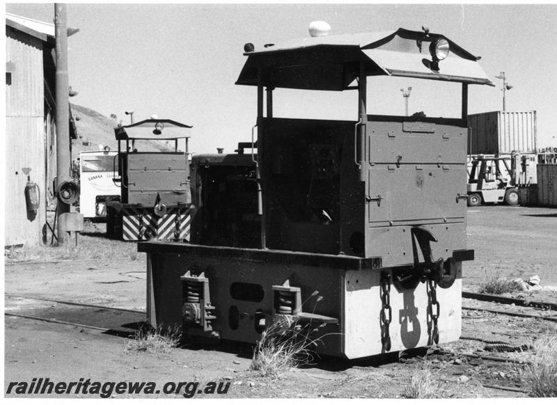P05910
PWD 0-4-0 diesel loco, Wyndham Meat Works, side and end view, other locos in background. One has 
