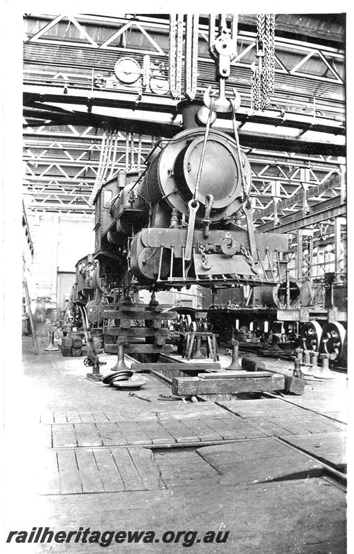 P07606
F class locomotive being moved by the overhead crane, Fitting Shop, Block 3, Midland Workshops, view along the Shop
