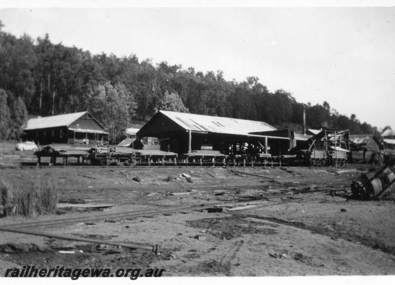 P08255
Millars timber mill, Nanga Brook, overall view, shows the Nanga Brook hall in the background.
