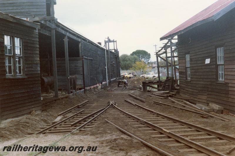 P08267
Trackwork being altered, Yarloop workshops, view along track between the buildings
