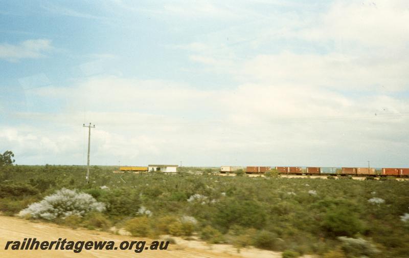 P08617
Eneabba, station building, train in siding, distant view from road, DE Line.
