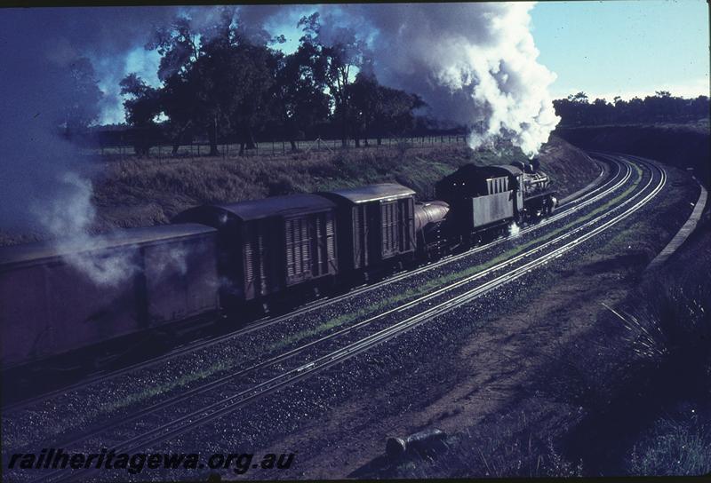 P09672
PMR class 734, down goods on Avon Valley route, water tank behind tender, Great Eastern Highway overbridge, north of Bellevue. ER line.
