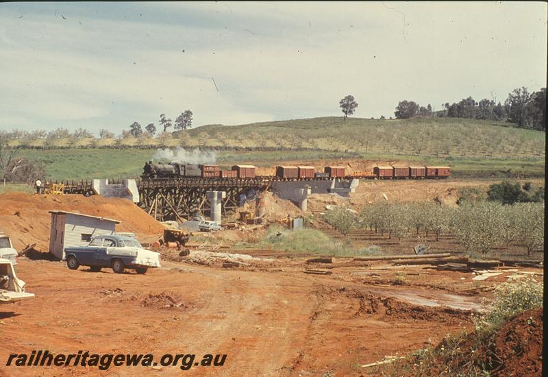 P09907
W class, down goods, on trestle, new bridge under construction, Balingup. PP line.
