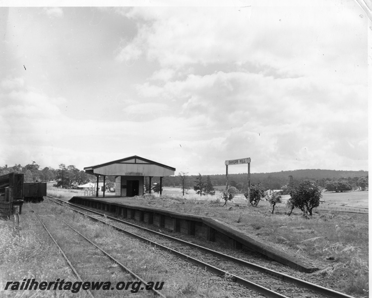 P10421
Platform at Bakers Hill showing canopy over building, station nameboardboard, up main line, goods siding with wagon and portion of loading ramp for sheep/cattle.ER line
