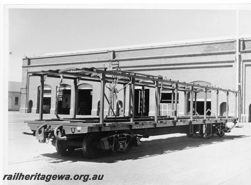 P10517
QCF class 23665 flat top wagon fitted with car body stanchions for use in car body transport from Parkeston.
