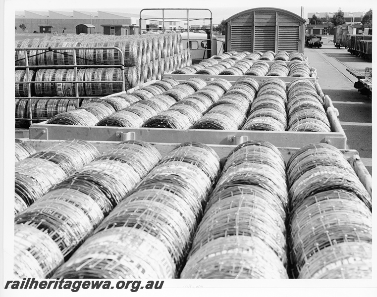 P10575
Cyclone wire fencing, in coils, loaded into open wagons at Kewdale.
