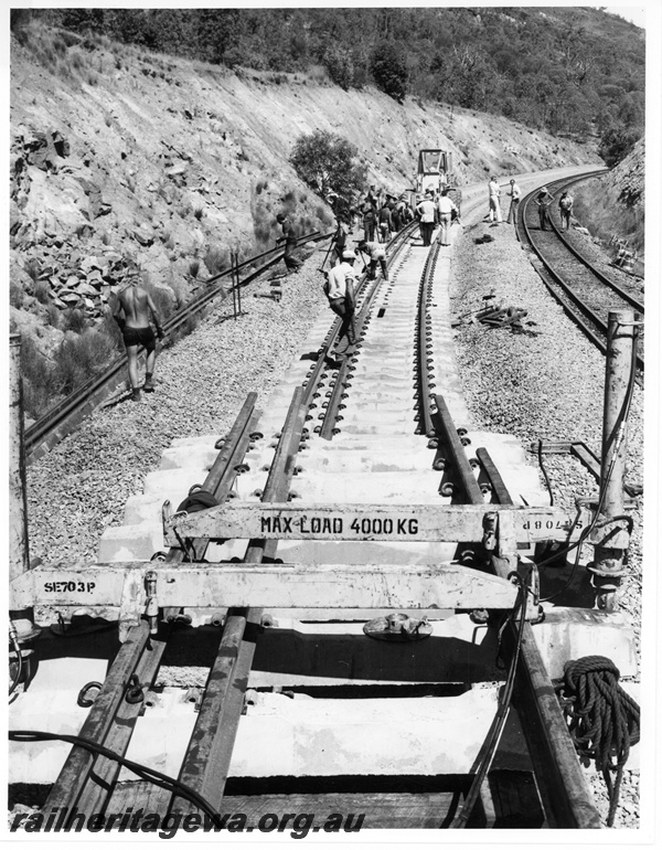 P10680
Laying dual gauge track, tractor, workers, Avon Valley line, view from track laying train
