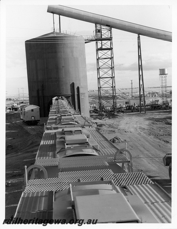 P10700
An overhead view of mineral sands wagons, showing roof details, at the Eneabba loading point. Z class brakevan on the run round road waiting to be placed at end of train. DE line
