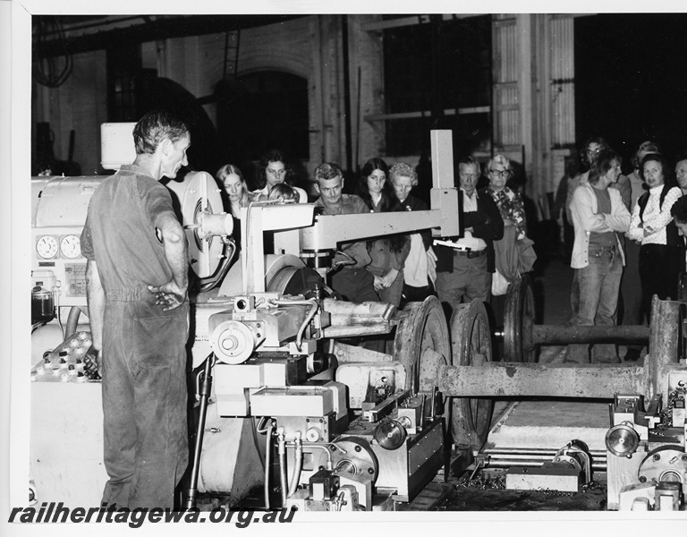 P10706
Wheel lathe, Midland Workshops, being watched by a group of onlookers 
