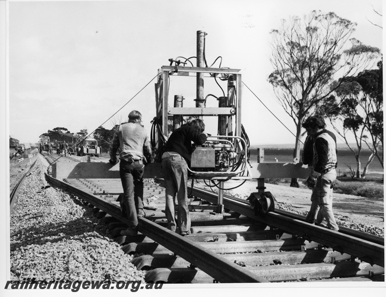 P10713
Rail/sleeper inserting machine in operation on the Esperance line.
