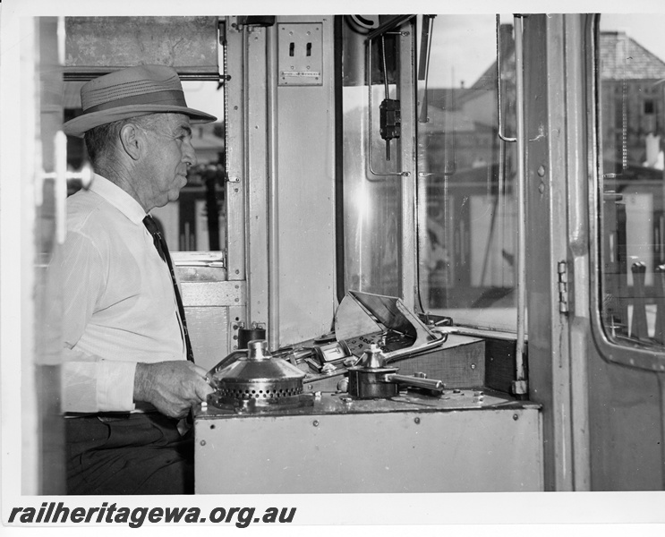 P10724
A Mechanical Officer at the controls of a suburban railcar at Perth Station.
