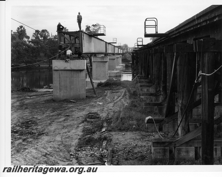 P10740
Construction of a new concrete rail bridge, adjacent to the former wooden bridge, at Guildford.
