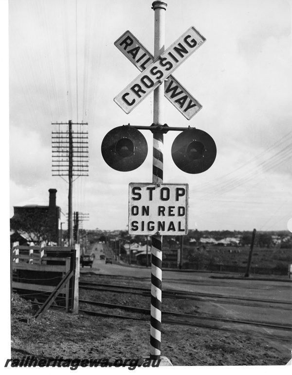 P10745
Level crossing flashing light at Great Eastern Highway, Rivervale, looking west towards Victoria Park, SWR line. Third line is a headshunt for Rivervale yard.
