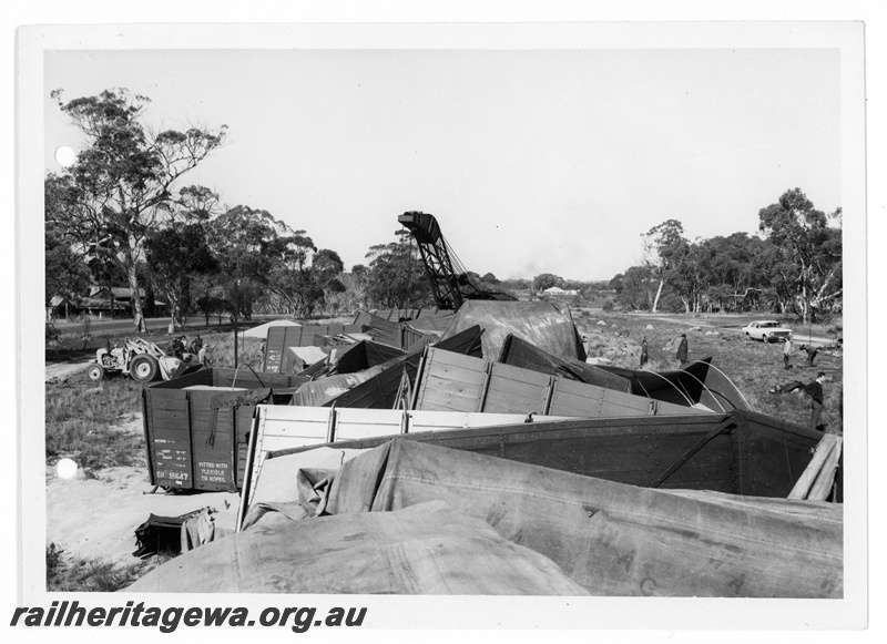 P10865
1 of 4 views of a derailed narrow gauge wheat train No 506 Goods near Carani, CM line, wagons including GH class 18647, GH class 18710 off the track, 25 ton breakdown crane N0.23 at the site, date of derailment 11/7/1969
