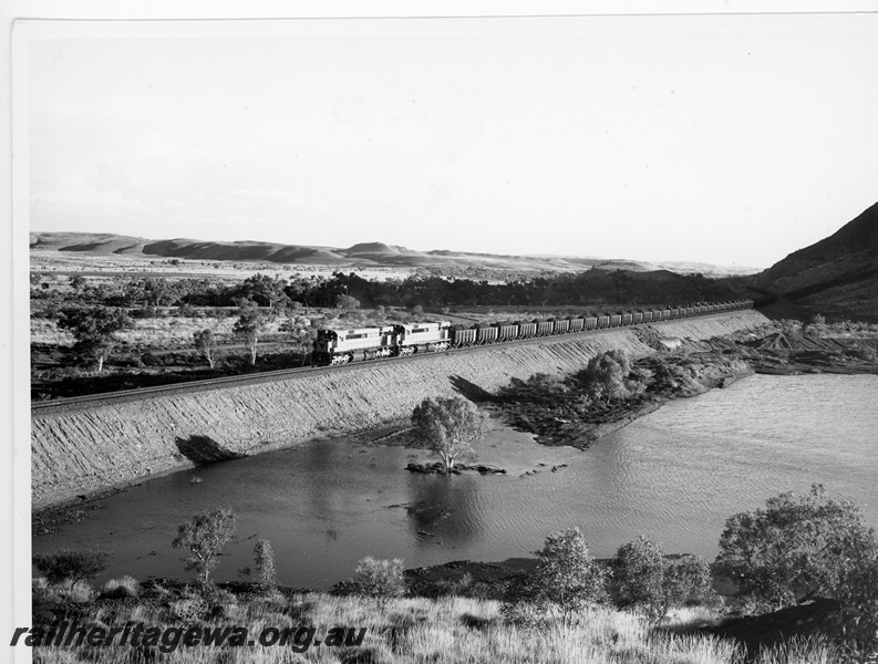 P10910
Cliffs Robe River (CRRIA) M636 class 1715, 1716 haul loaded iron ore train near Western Creek.
