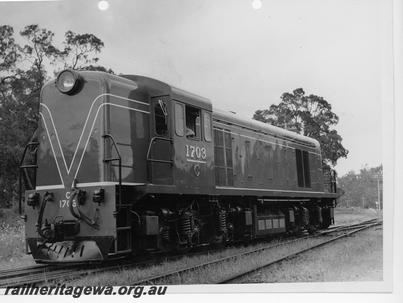 P10974
C class 1703, in green livery with red and white stripe, end and side view

