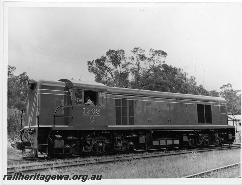 P11000
C class 1703, in green and red livery, side view
