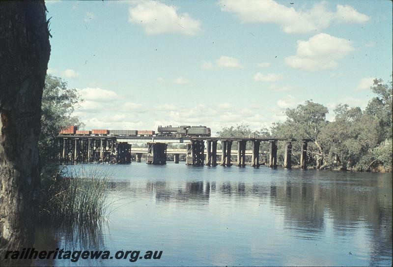 P11439
U class 655, tender first on Bassendean shunter, Guildford bridge, trestle bridge. ER line.
