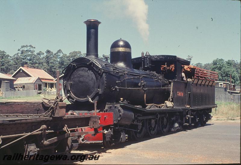 P11810
State Saw Mills loco SSM 7, with empty bogie flat wagon crossing SW Highway on way to Pemberton mill., front and side view, 
