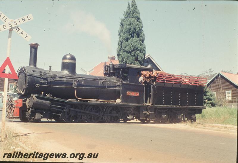 P11815
Sate Saw Mills loco SSM 7, shunting across Vasse Highway near Pemberton mill. front and mainly side view of loco

