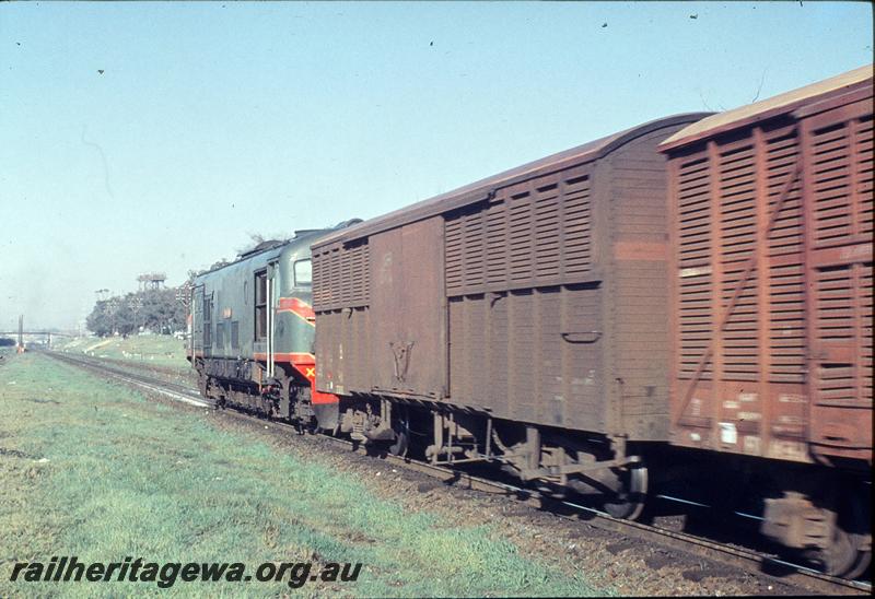 P12148
X class, up freight, water tower, footbridge in background, East Perth loco shed. ER line.
