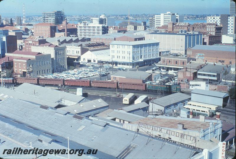 P12248
Pier St, Perth, with R class on up goods, from top of Canterbury Court. ER line.
