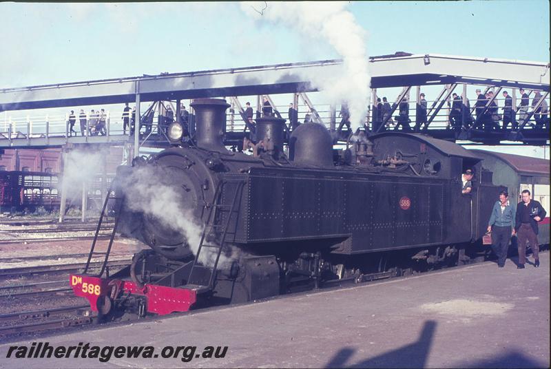 P12305
DM class 588, suburban passenger, Midland Junction, platform, old footbridge, new footbridge under construction, part of workshops in background. ER line.
