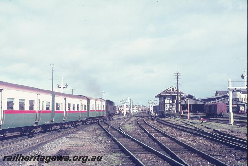 P12313
DD class 597 on last steam passenger ex Armadale, pulling empty coaches to carriage sheds, Perth, signal box B, carriage sheds. ER line.
