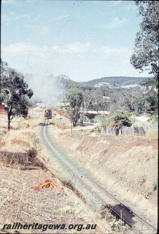 P12426
W class 922, W class 924, level crossing, 2nd ballast train climbing bank from river bridge into Bridgetown, PP line. Additional wagons for brake power.
