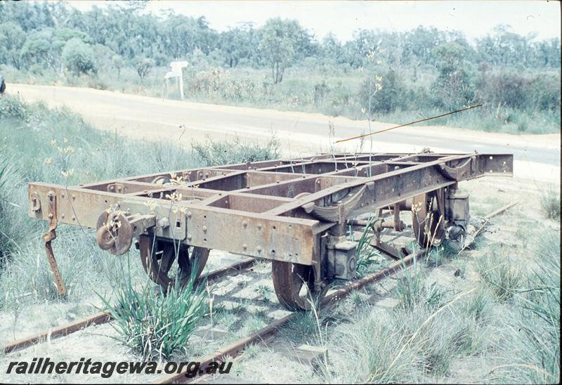 P12450
Abandoned wagon on mill line, level crossing east of Northcliffe. Steel underframe.
