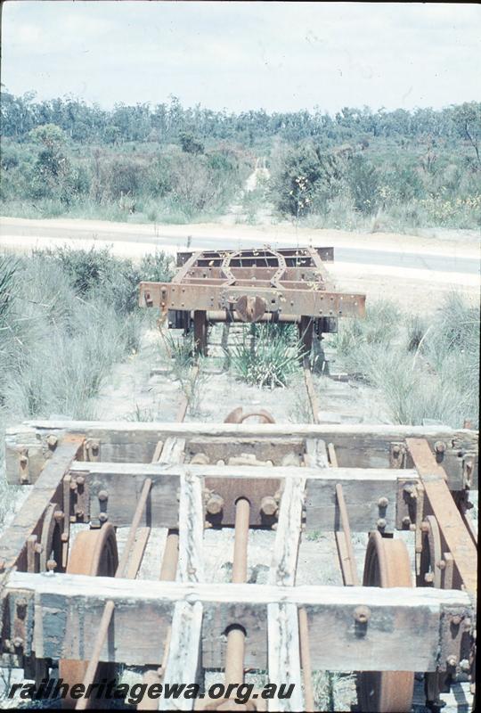 P12451
Mill line, level crossing east of Northcliffe. Abandoned wagons, one with steel underframe, one with wooden underframe.
