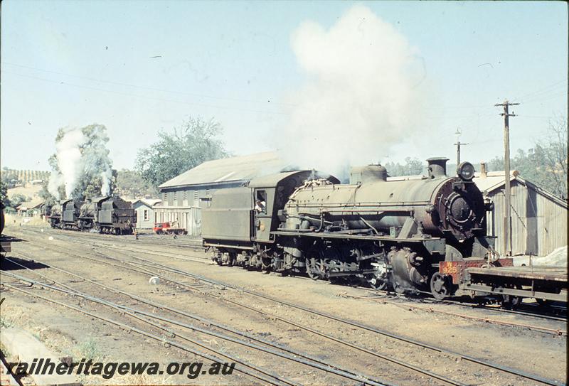 P12491
W class 925 shunting, W class 944 and W class waiting for 333 goods, loco shed in background, gang shed with gangers trolleys, Bridgetown, PP line.
