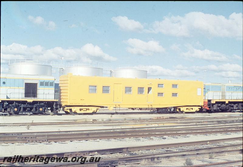 P12493
WSC class 30630 Crew Living Van in as new condition, all over yellow livery,  Forrestfield yard, end and side view, SG line.
